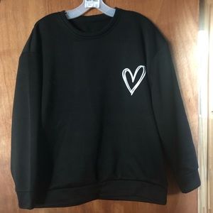 Black sweatshirt with white heart on the right side